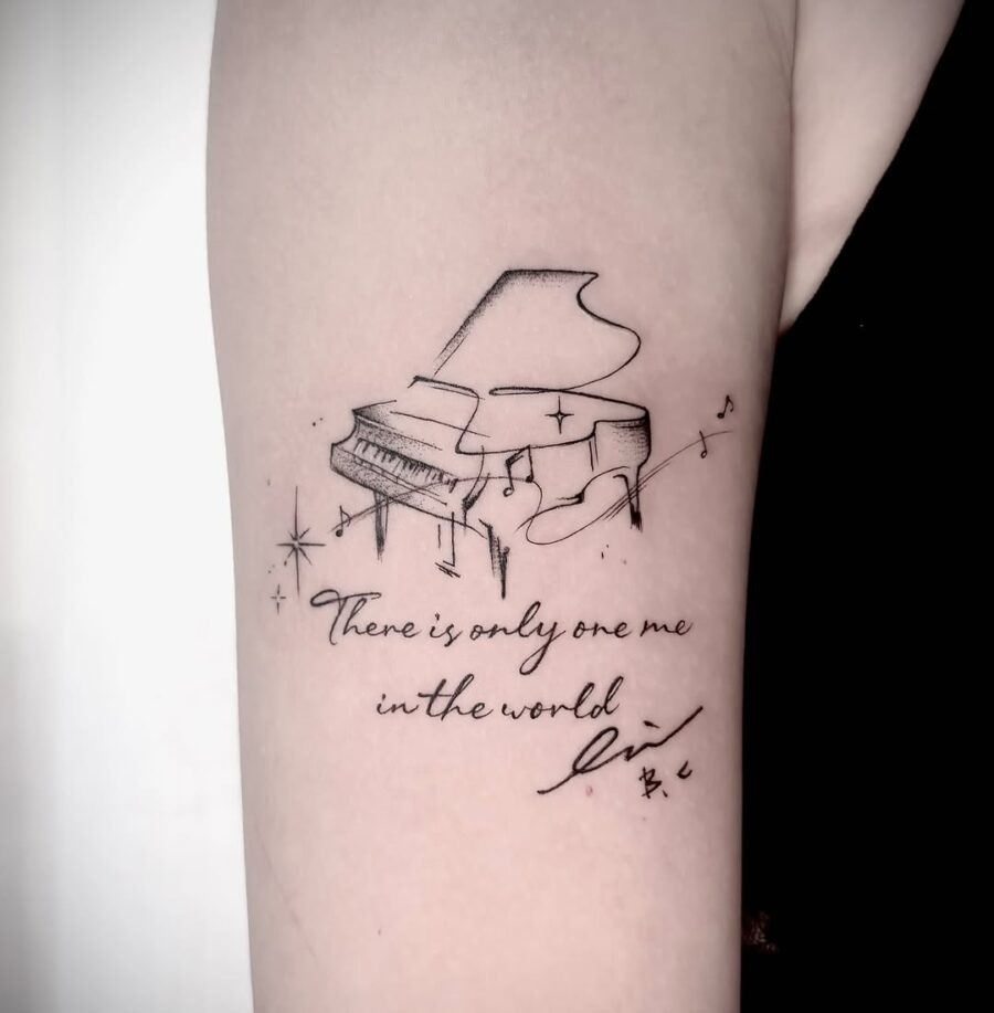 Elegant piano tattoo with a heartfelt message Tattoo Design