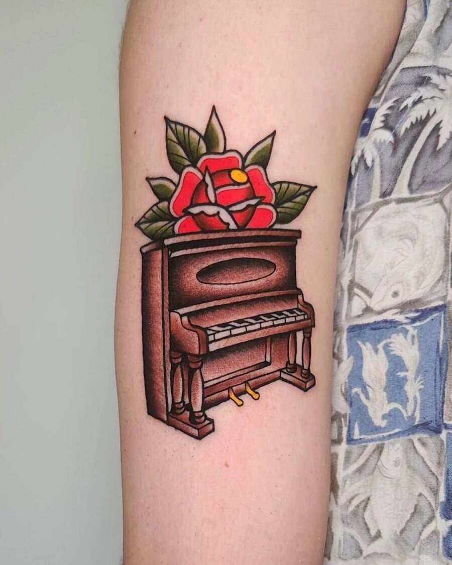 Elegant piano tattoo with vibrant floral accents Tattoo Design