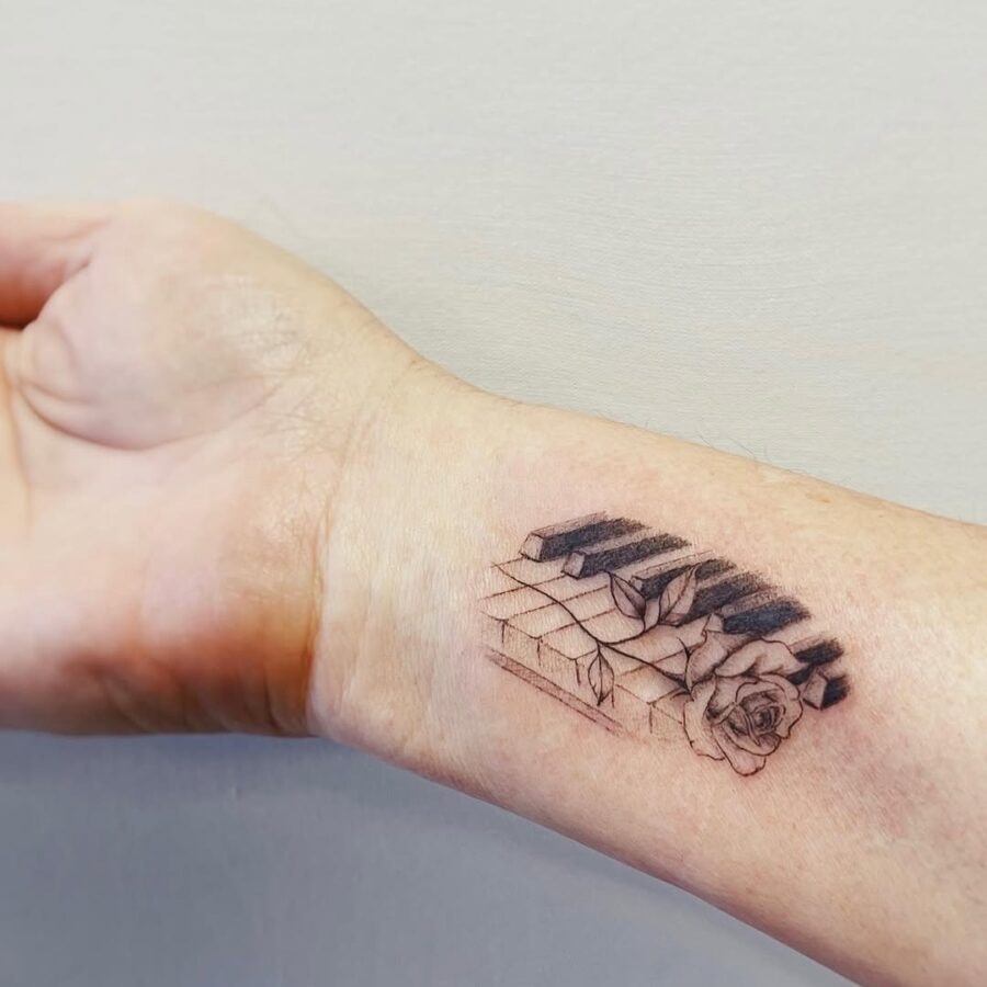 Intricate piano and rose tattoo blending art Tattoo Design