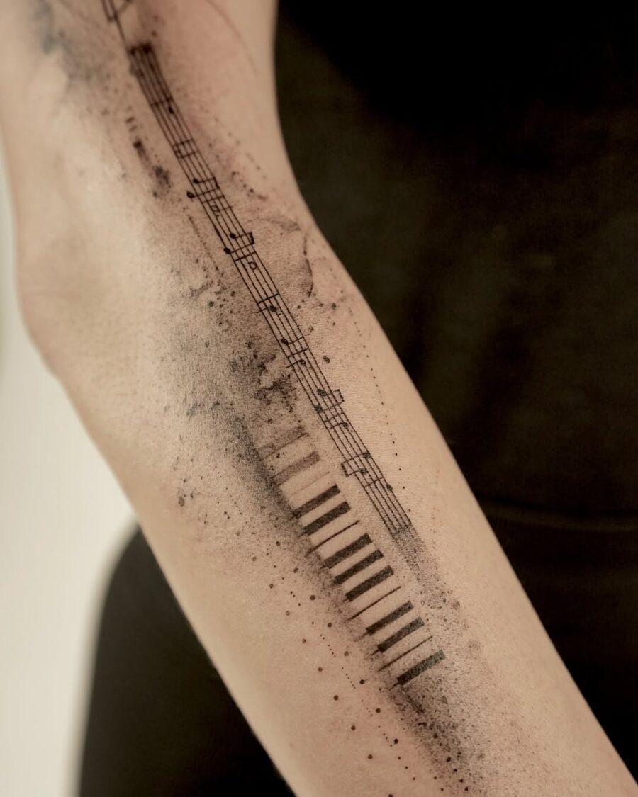 Minimalist piano tattoo with musical details Tattoo Design