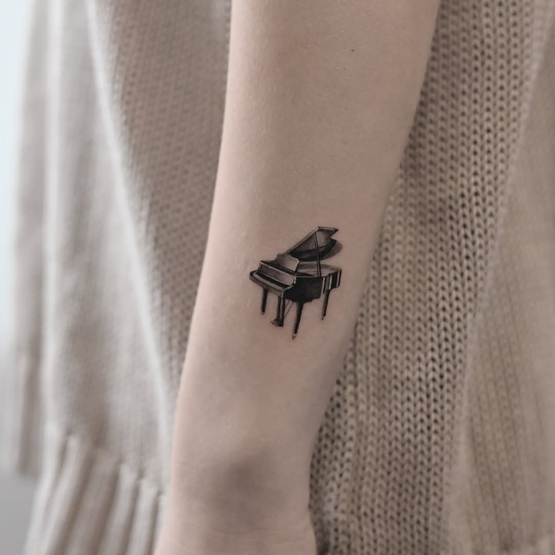 Stylish Minimalist Piano Tattoo on Forearm Tattoo Design