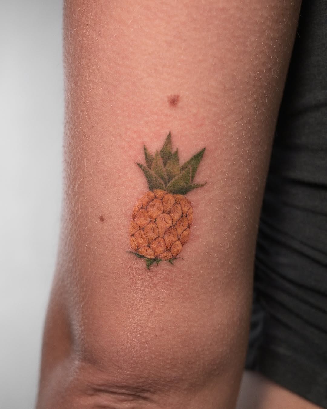 Vibrant pineapple tattoo brings tropical vibes Tattoo Design