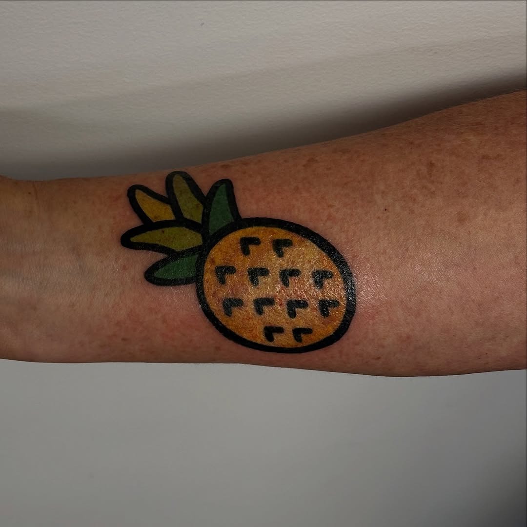 Vibrant Pineapple Tattoo on Forearm Tattoo Design