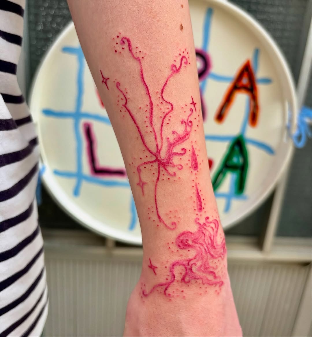 Artistic pink tattoo with intricate swirling designs Tattoo Design