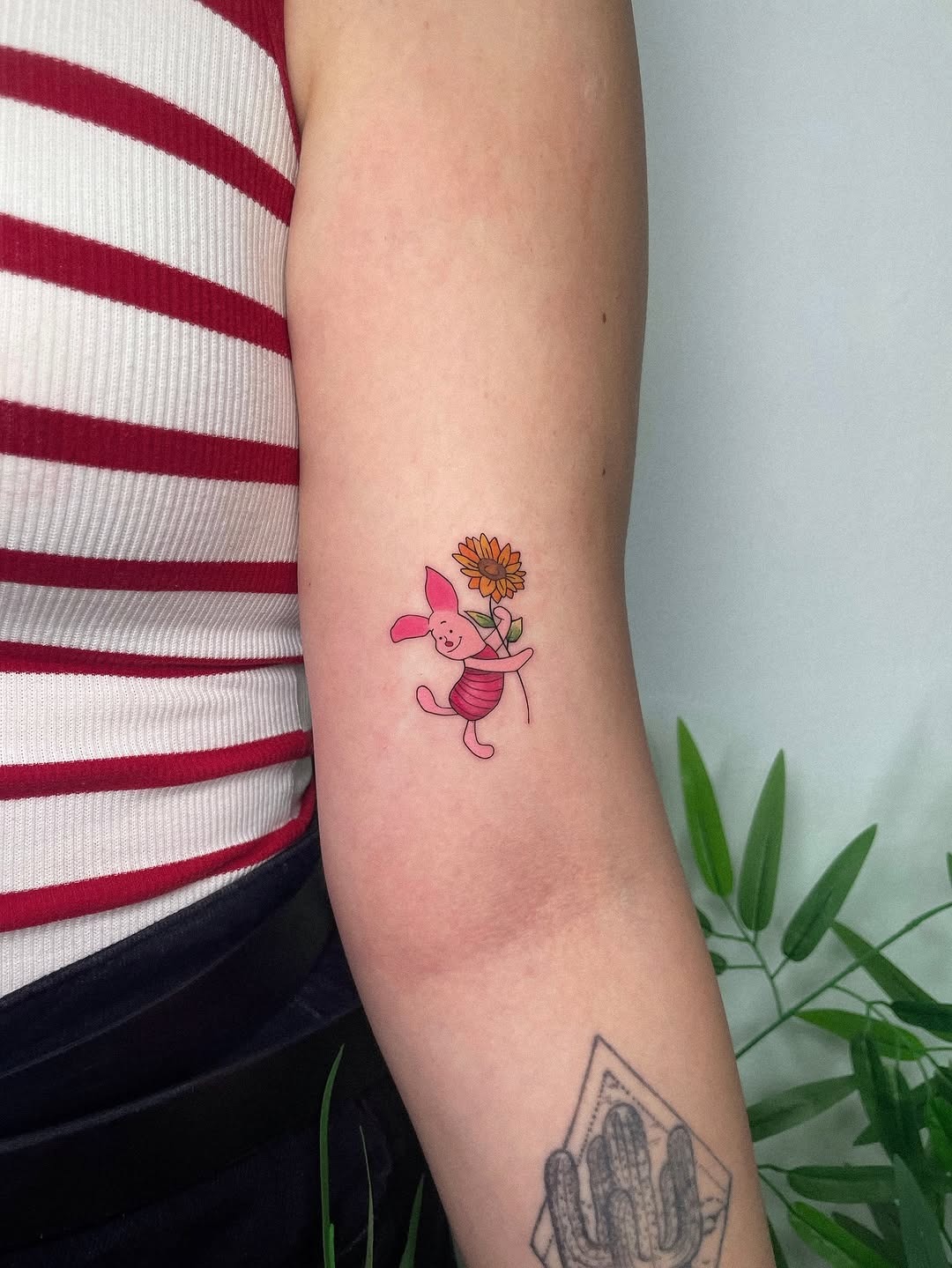 Charming pink pig tattoo with sunflower detail Tattoo Design