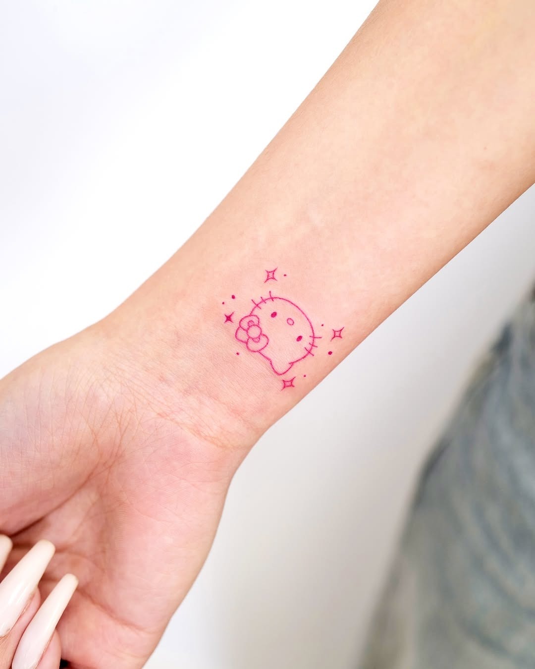 Charming pink skull tattoo with cute details Tattoo Design