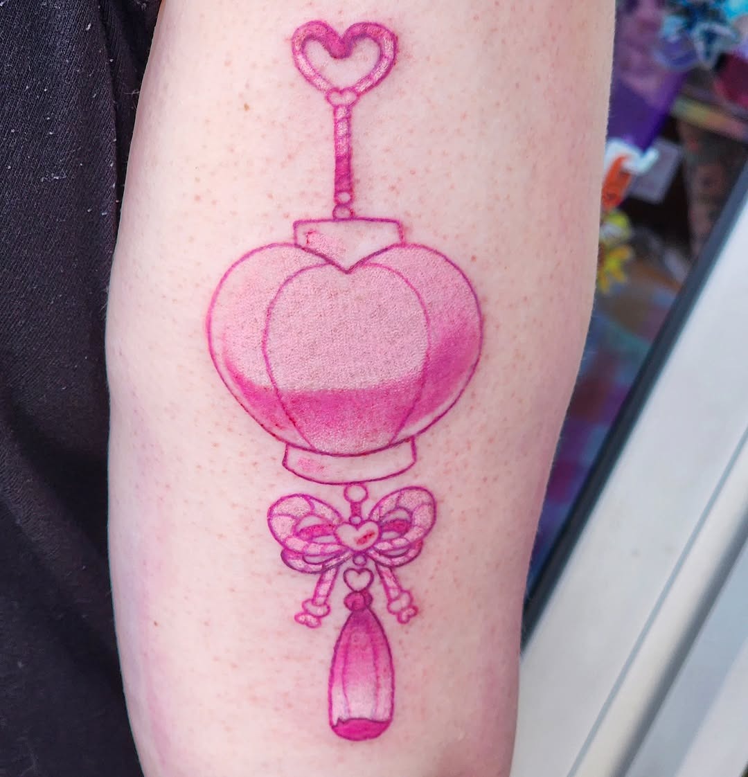 Charming pink tattoo design with whimsical elements Tattoo Design