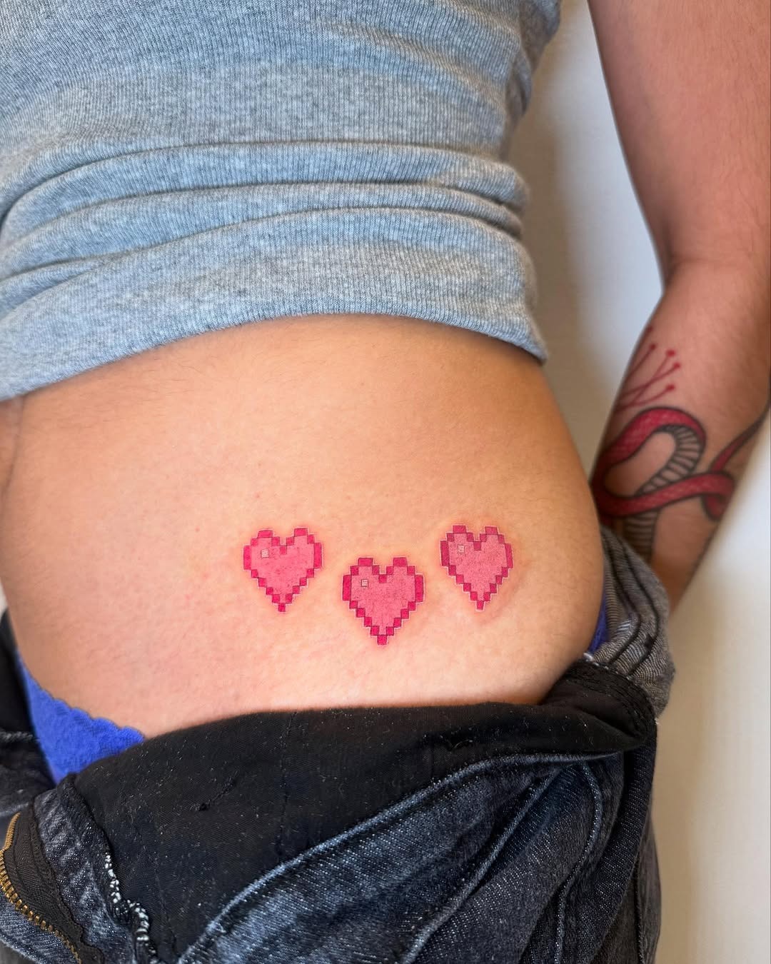 Charming pixel heart tattoos on the skin Tattoo Design