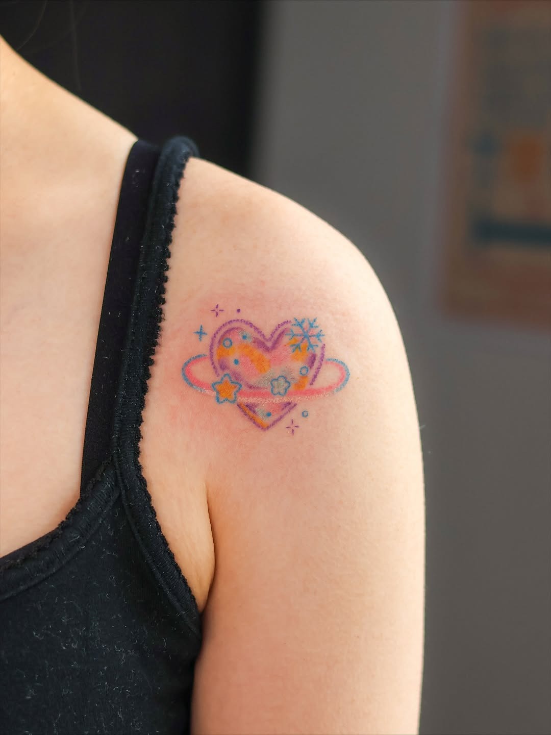 Colorful heart tattoo with cosmic elements Tattoo Design