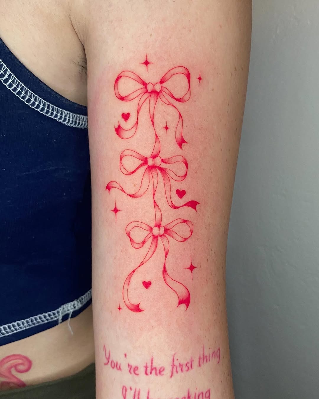 Delicate pink bows with a whimsical touch Tattoo Design