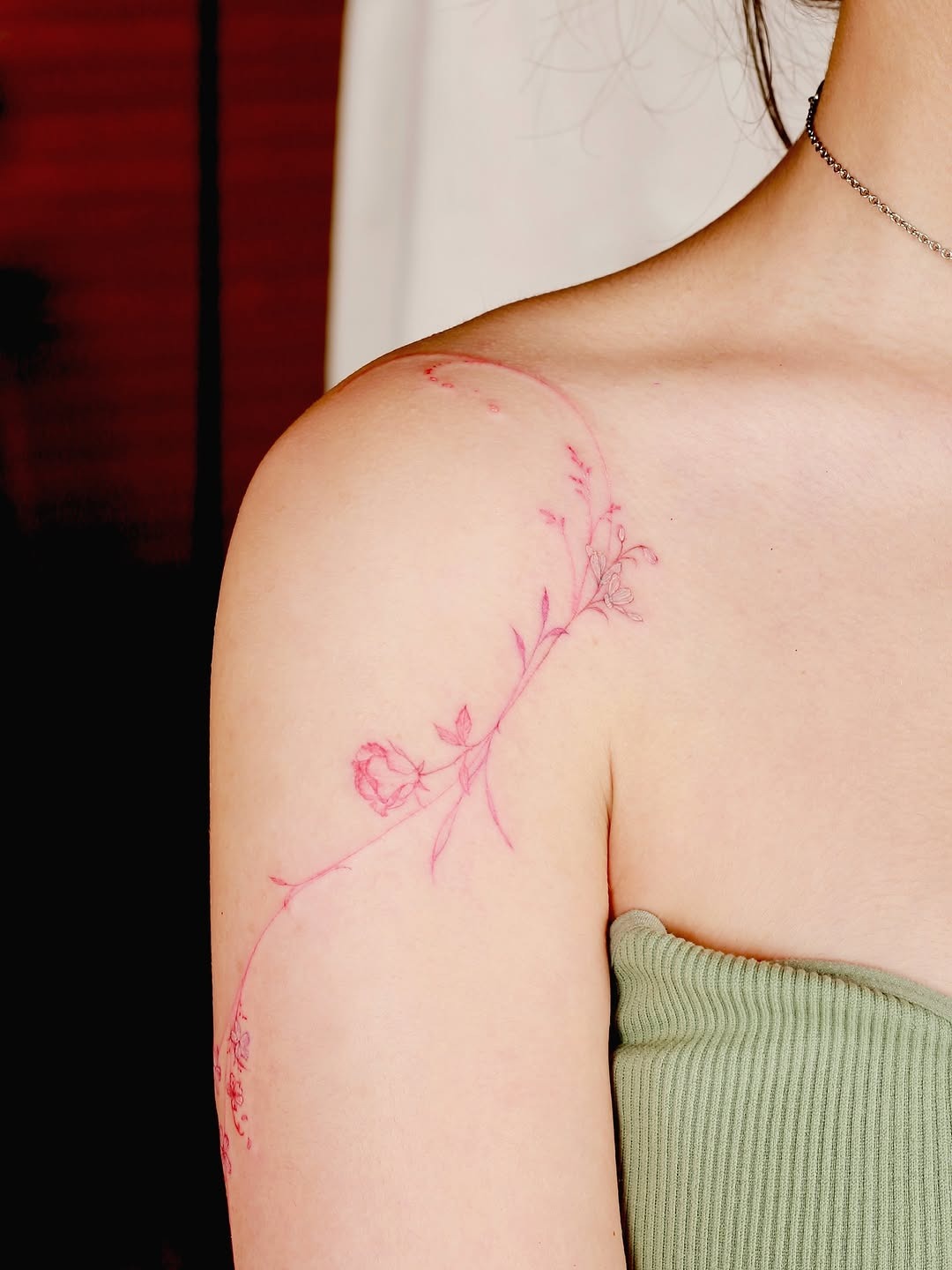 Delicate pink floral tattoo on the arm Tattoo Design
