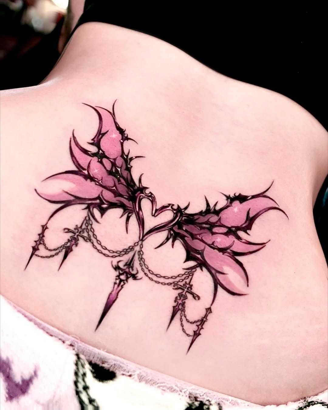 Elegant pink wings with edgy spikes detail Tattoo Design