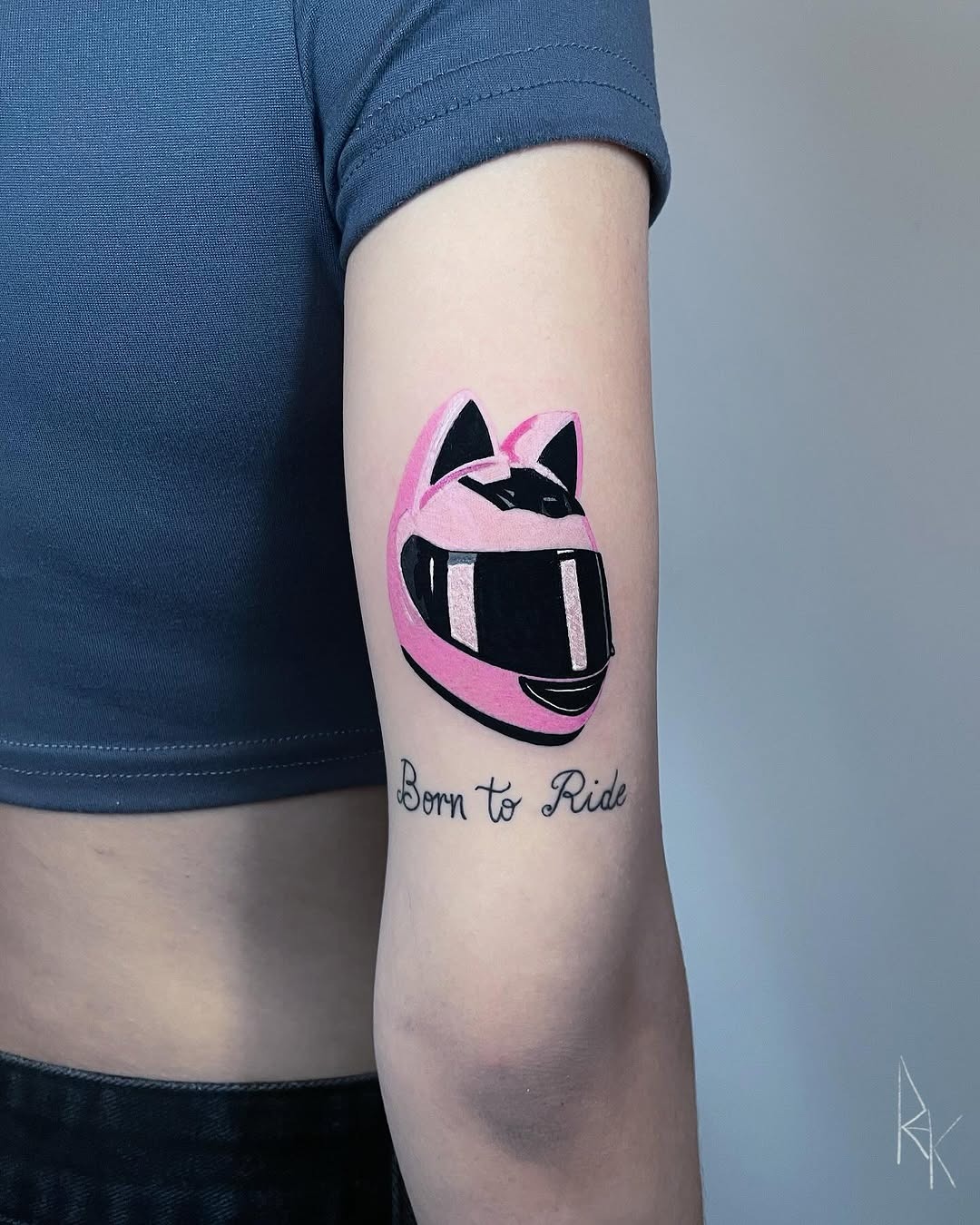 Stylish pink helmet tattoo with bold text Tattoo Design