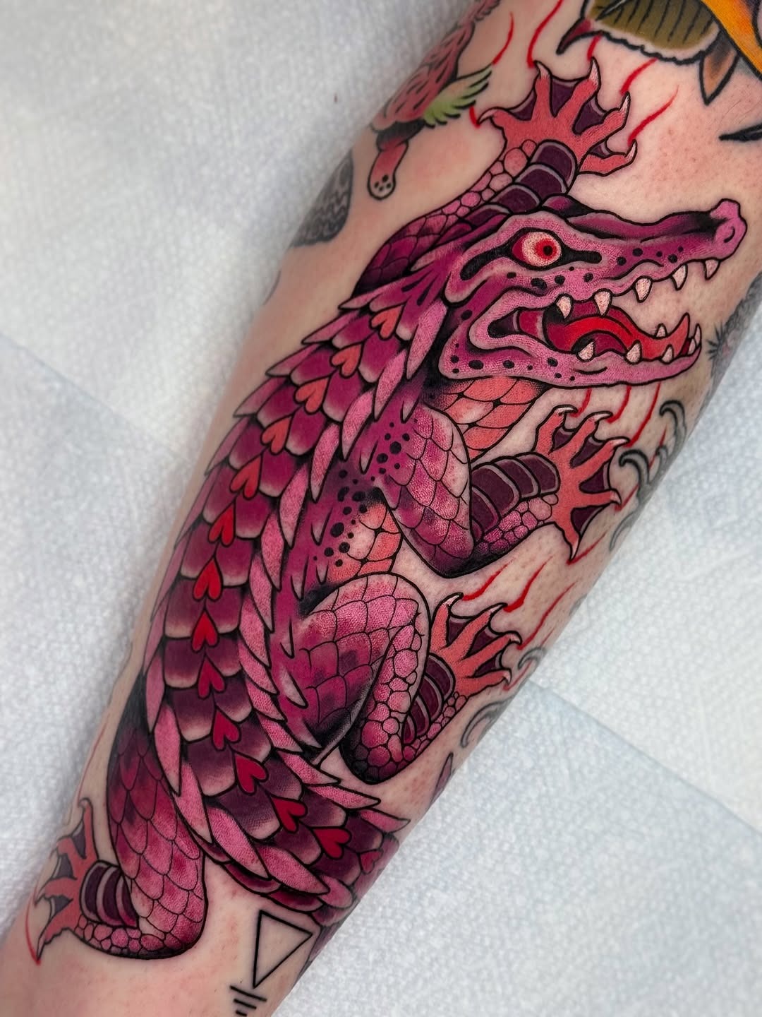 Vibrant pink dragon tattoo with dynamic details Tattoo Design