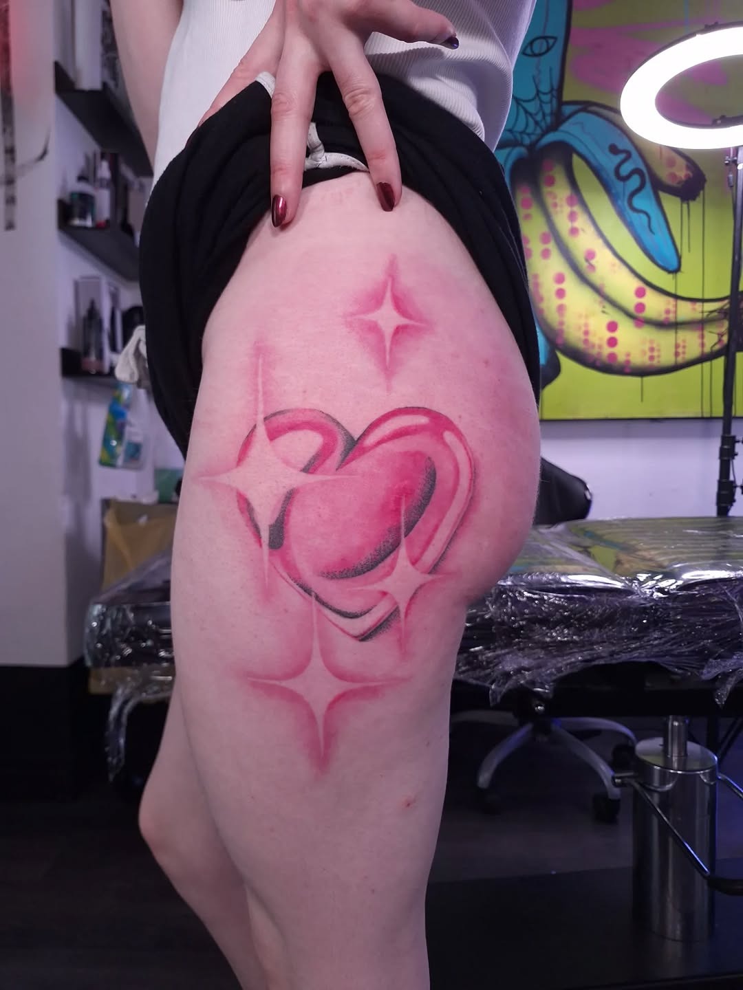 Vibrant pink heart tattoo with star accents Tattoo Design
