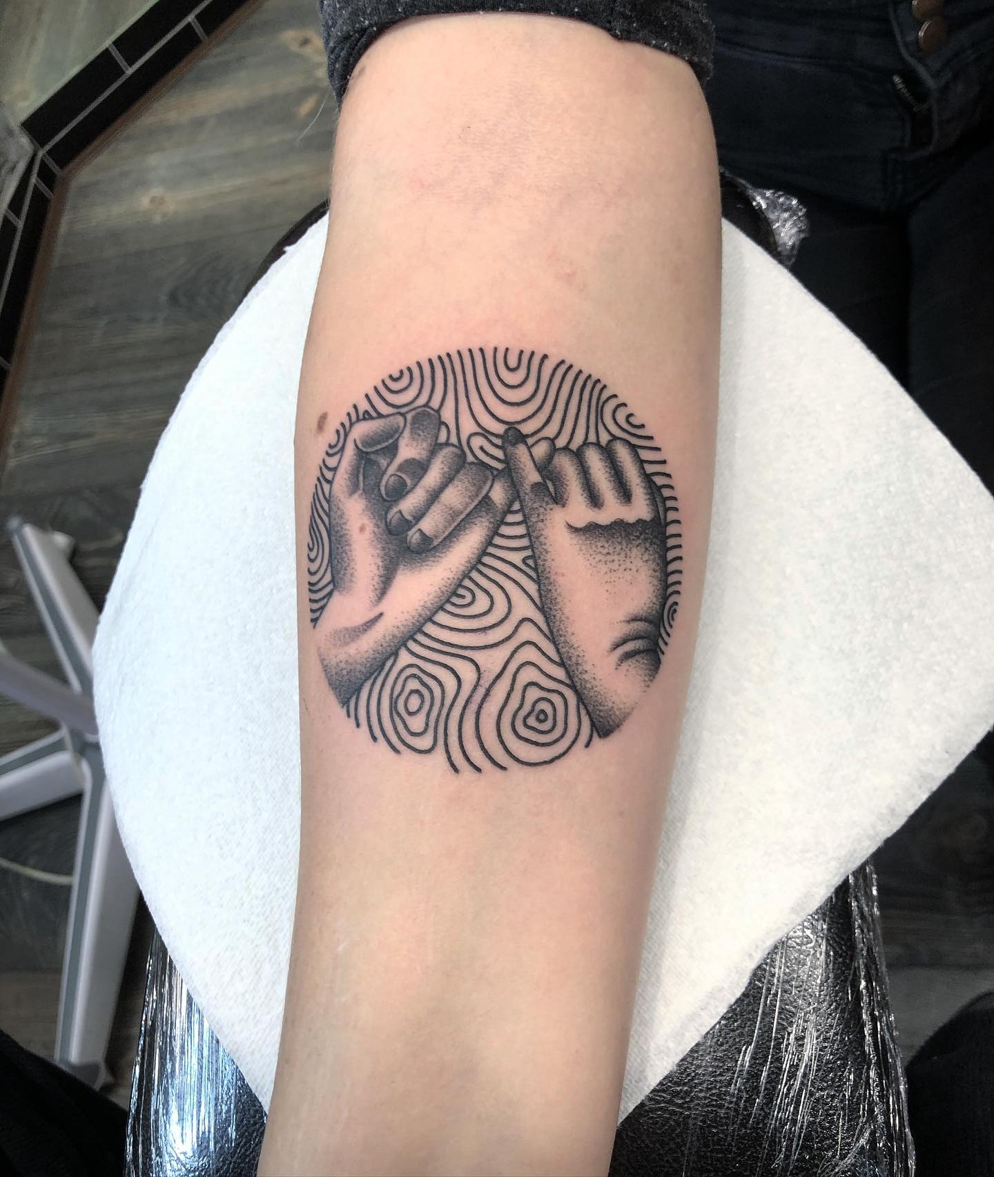 Artistic pinky promise tattoo with circular pattern Tattoo Design