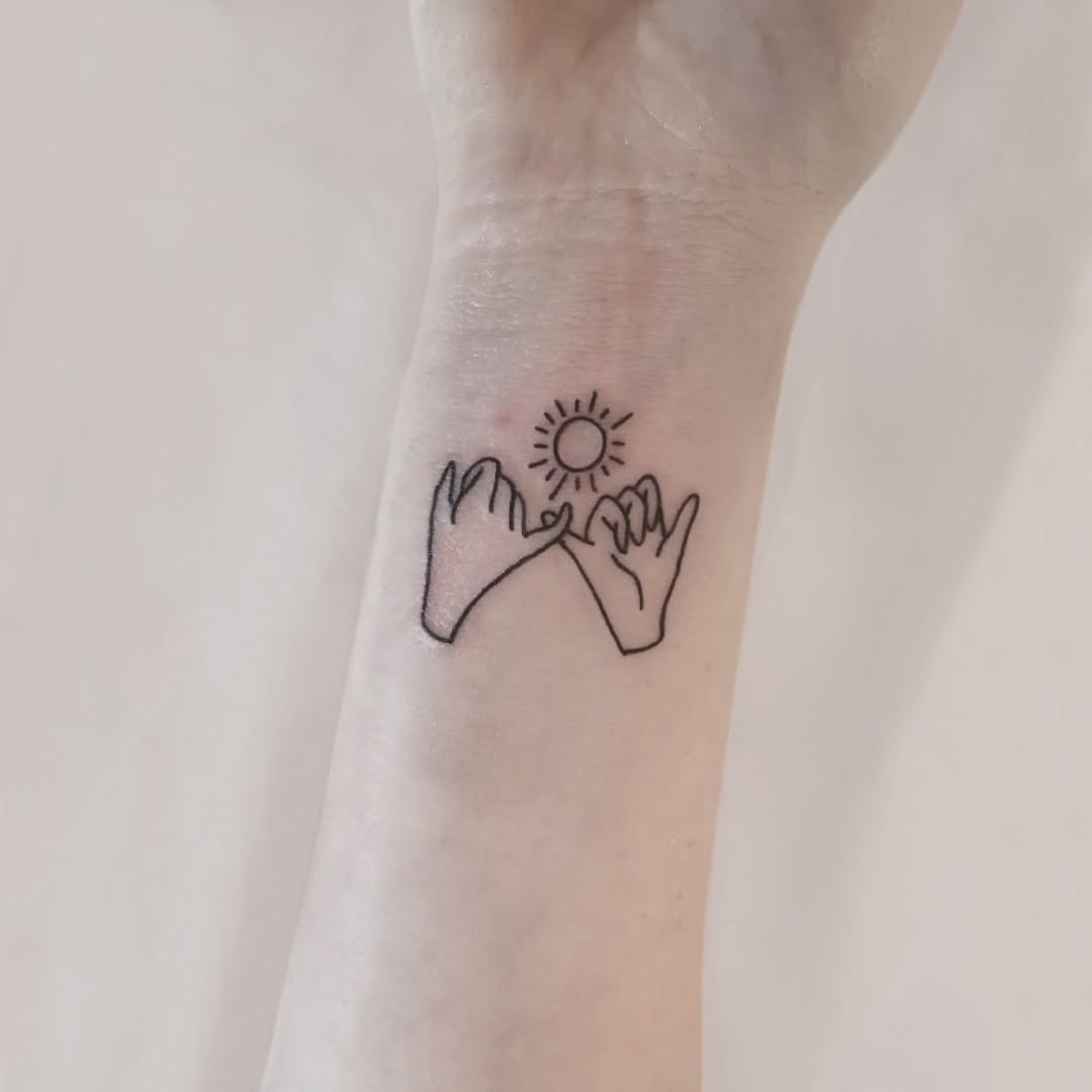 Meaningful pinky promise with a sunny vibe Tattoo Design