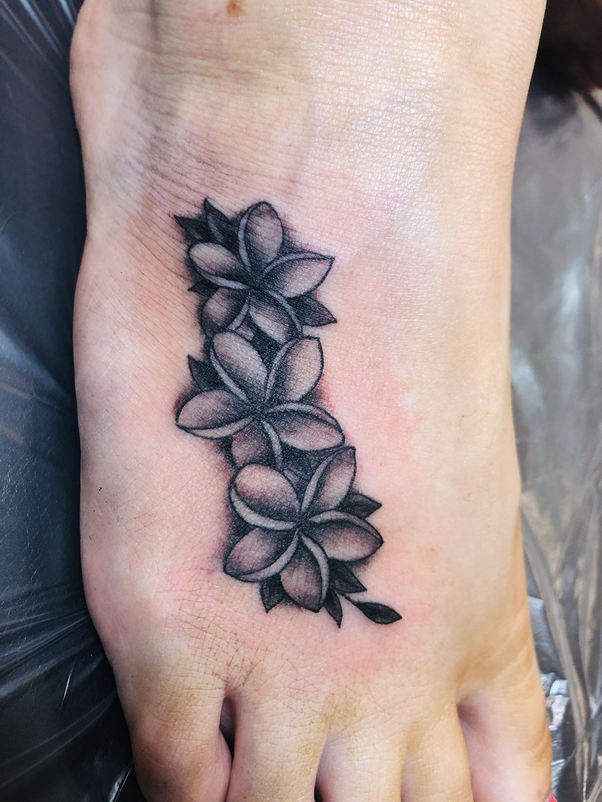 Dramatic Traditional Plumeria Sleeve Tattoo Design