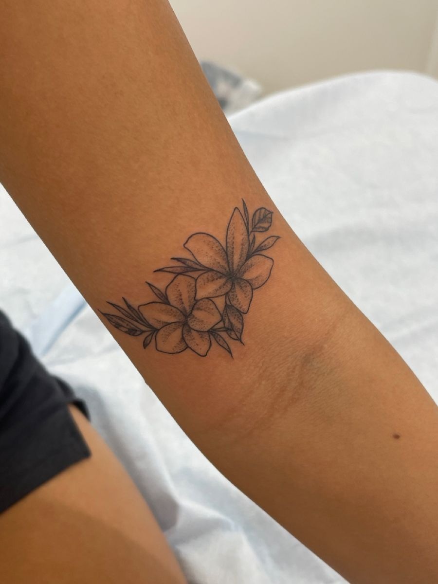 Soft Pink Plumeria Stem Tattoo Design
