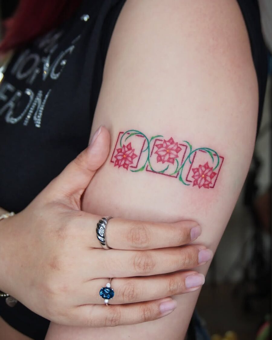 Charming Poinsettia Tattoo on the Arm Tattoo Design