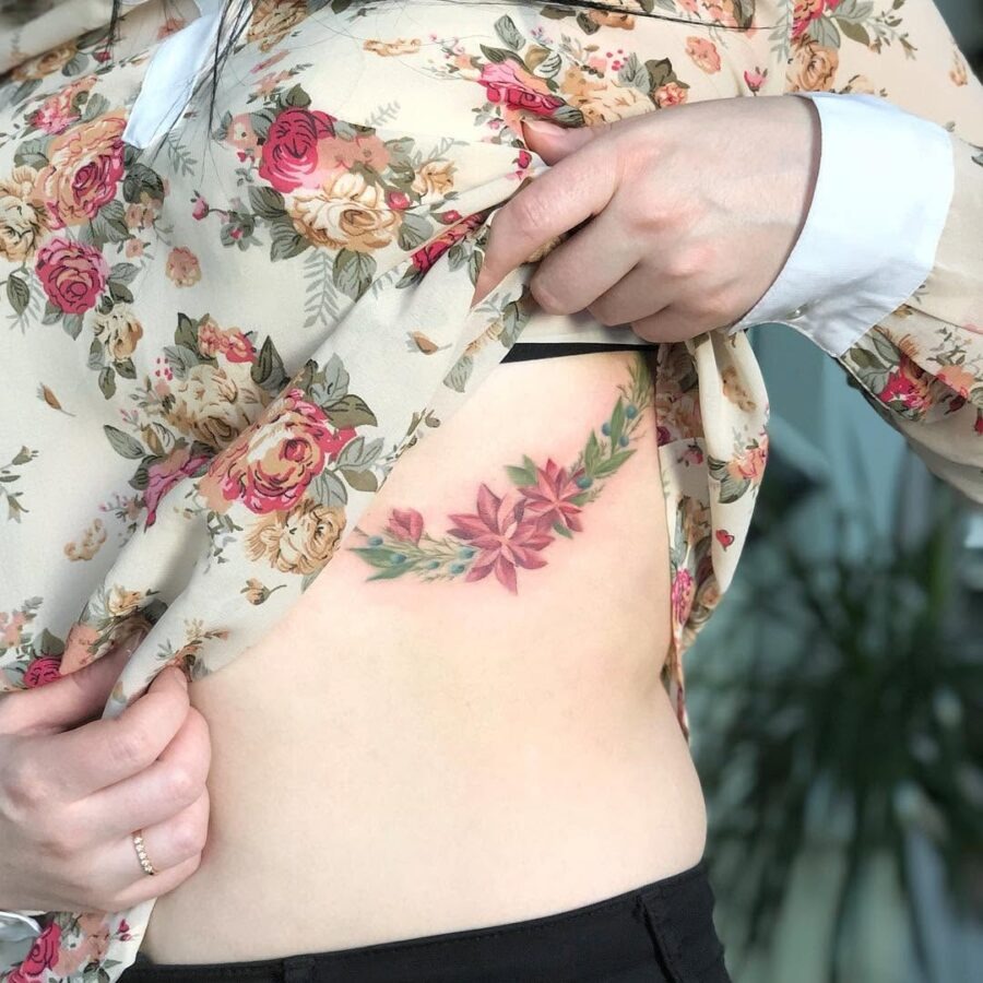 Elegant poinsettia tattoo on side body Tattoo Design