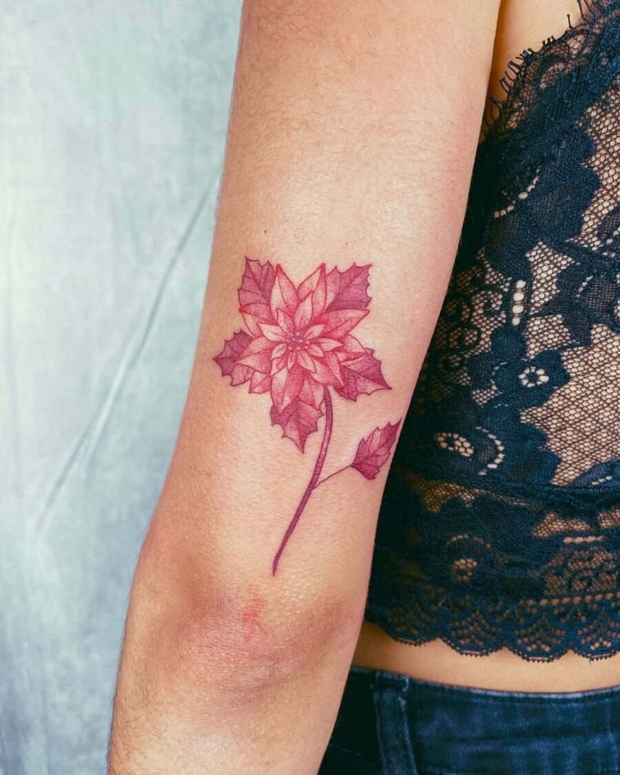 Elegant Poinsettia Tattoo with Bold Colors Tattoo Design