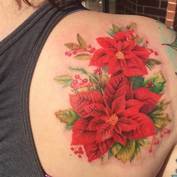 Vibrant Poinsettia Tattoo with Greenery Tattoo Design