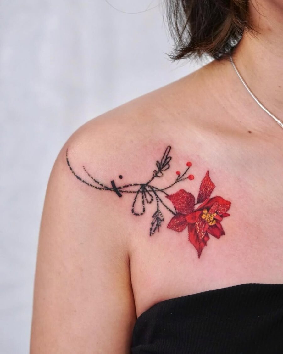 Vivid poinsettia tattoo accentuates shoulder elegance Tattoo Design