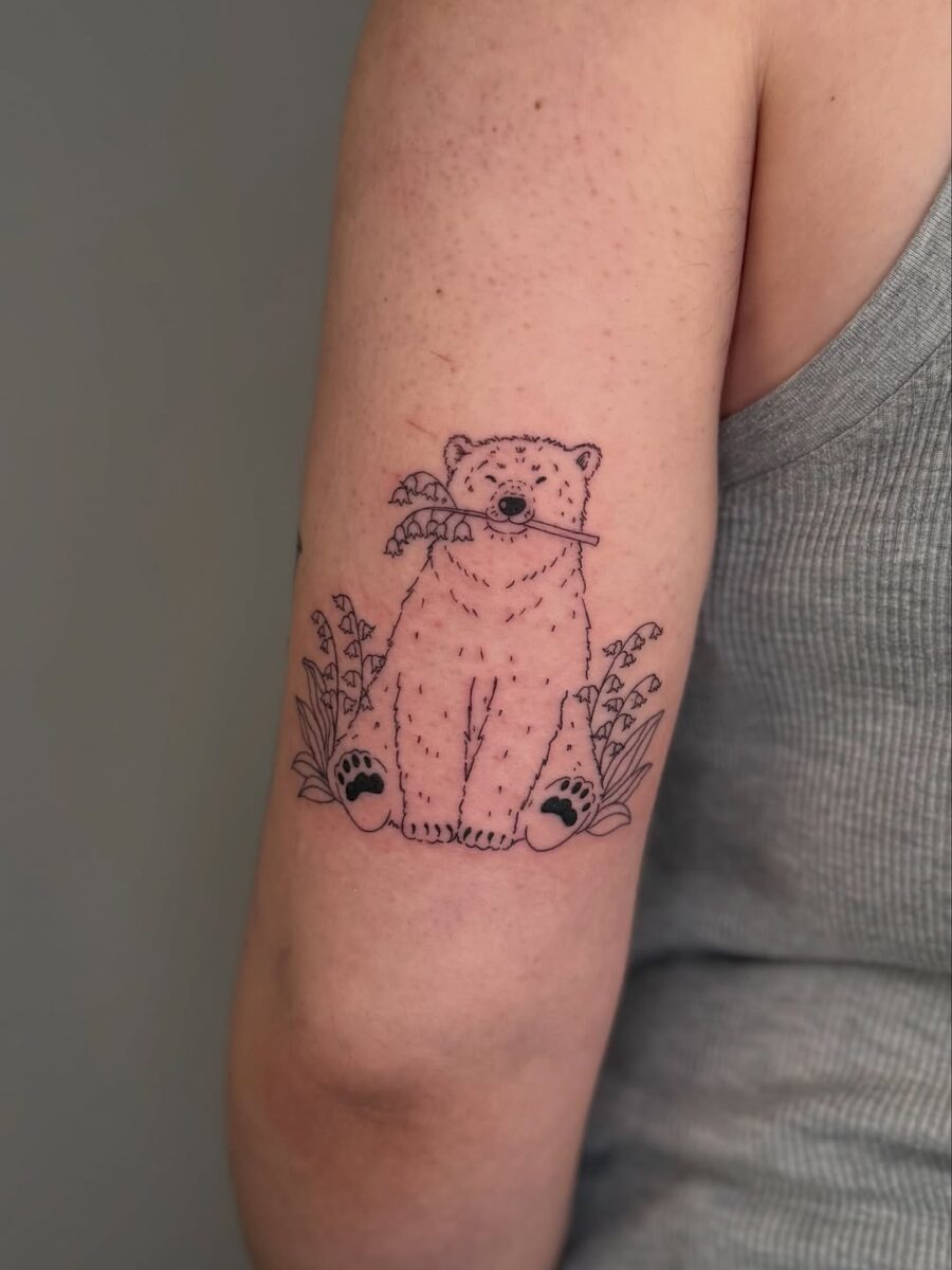 Charming polar bear tattoo sitting peacefully Tattoo Design