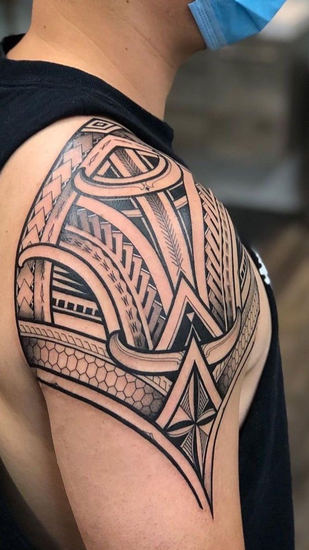 Spiral-Flow Polynesian Upper Arm Tattoo Design
