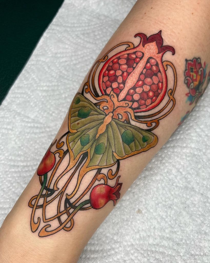 Classic Red Pomegranate with Soft Leaves Tattoo Design