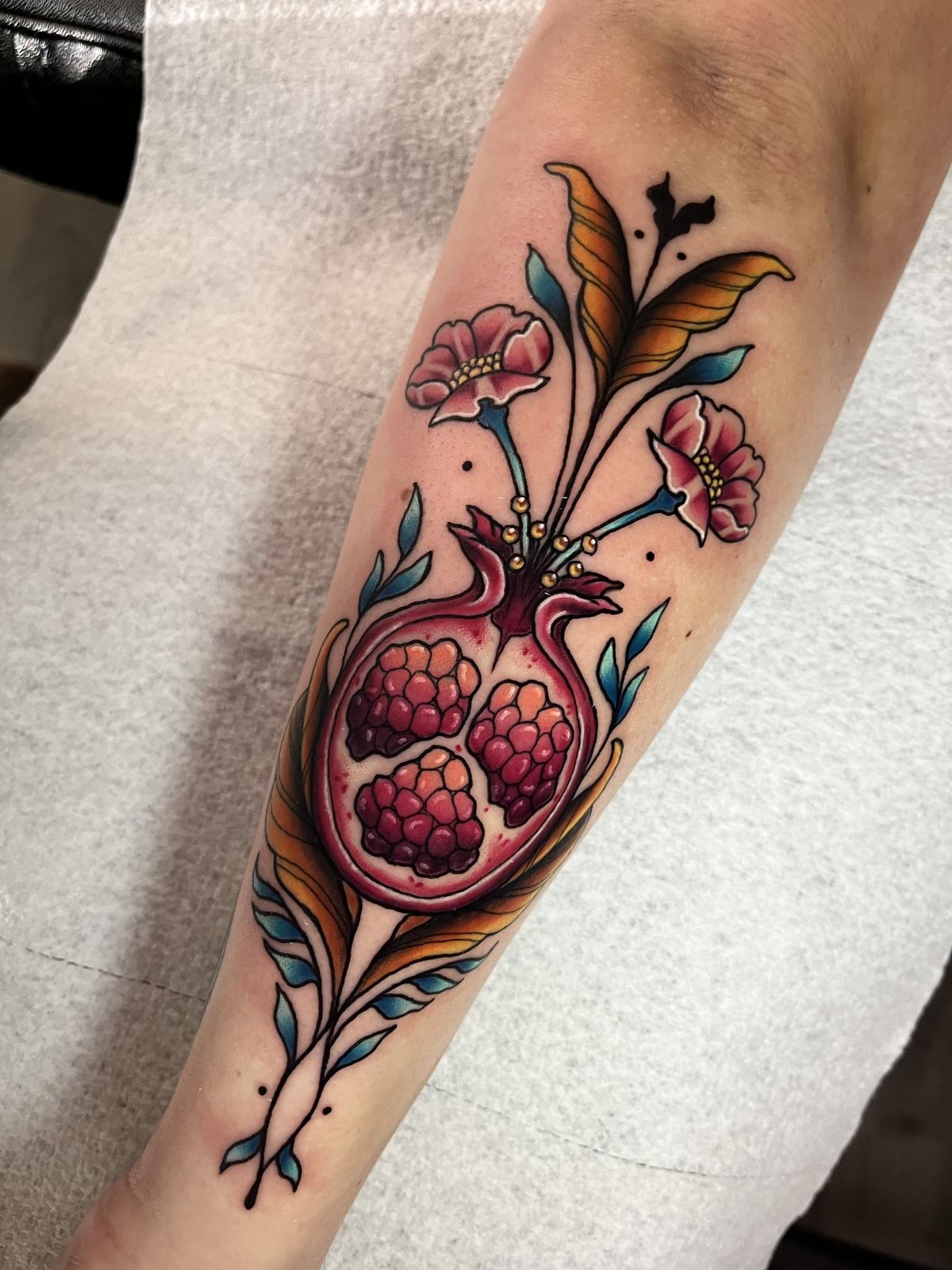 Realistic Broken Pomegranate with Scattered Seeds Tattoo Design