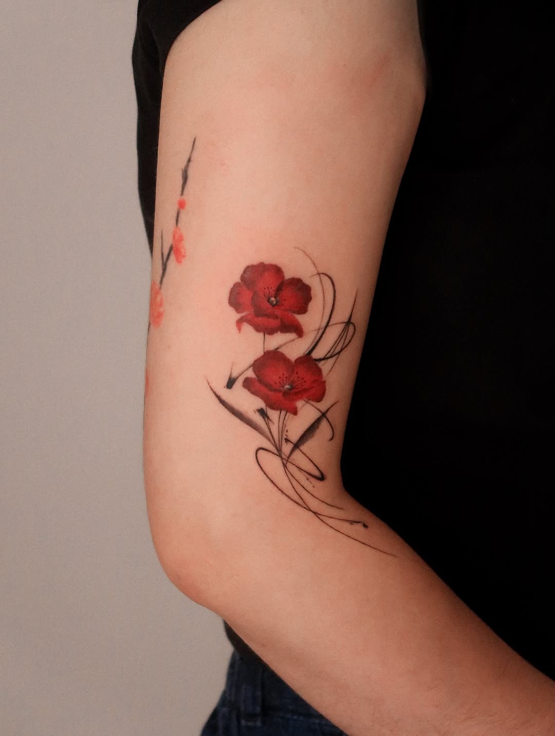 Bold Red Poppy Tattoo with Elegant Lines Tattoo Design
