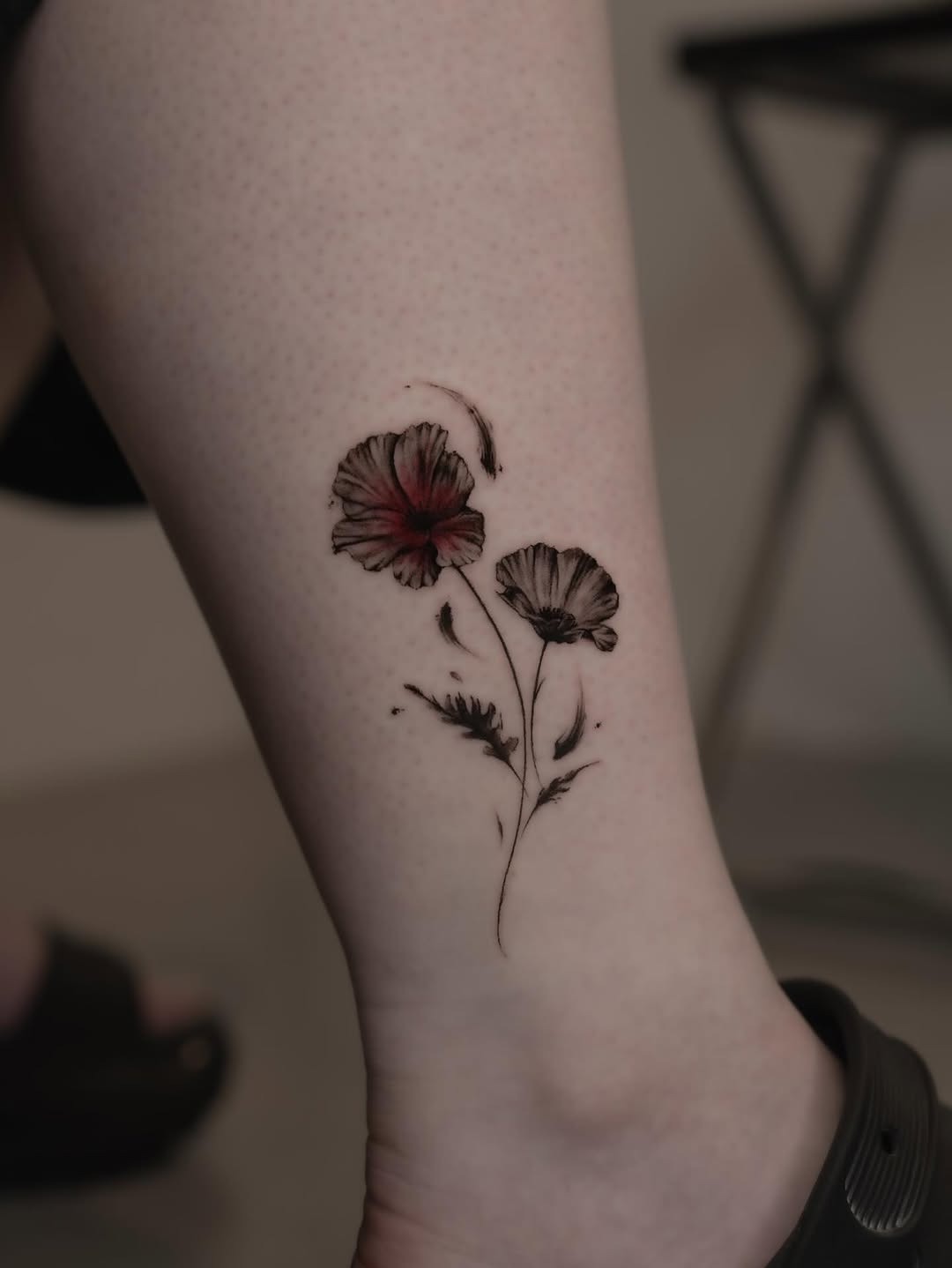 Elegant poppy tattoo with striking details Tattoo Design