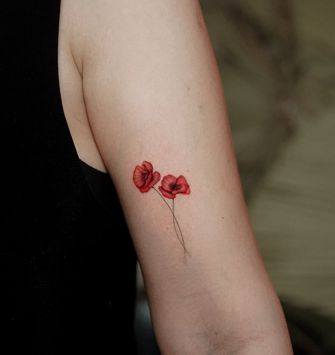 Elegant red poppy flowers with delicate stems Tattoo Design
