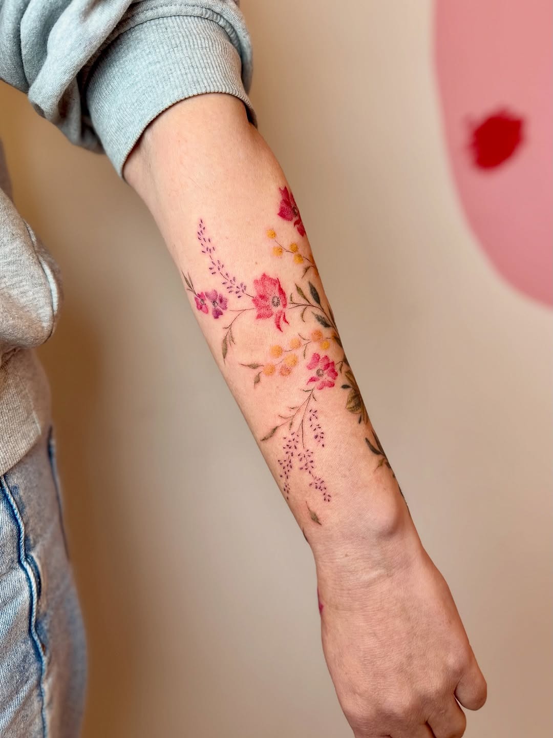 Vibrant floral poppy tattoo on forearm Tattoo Design