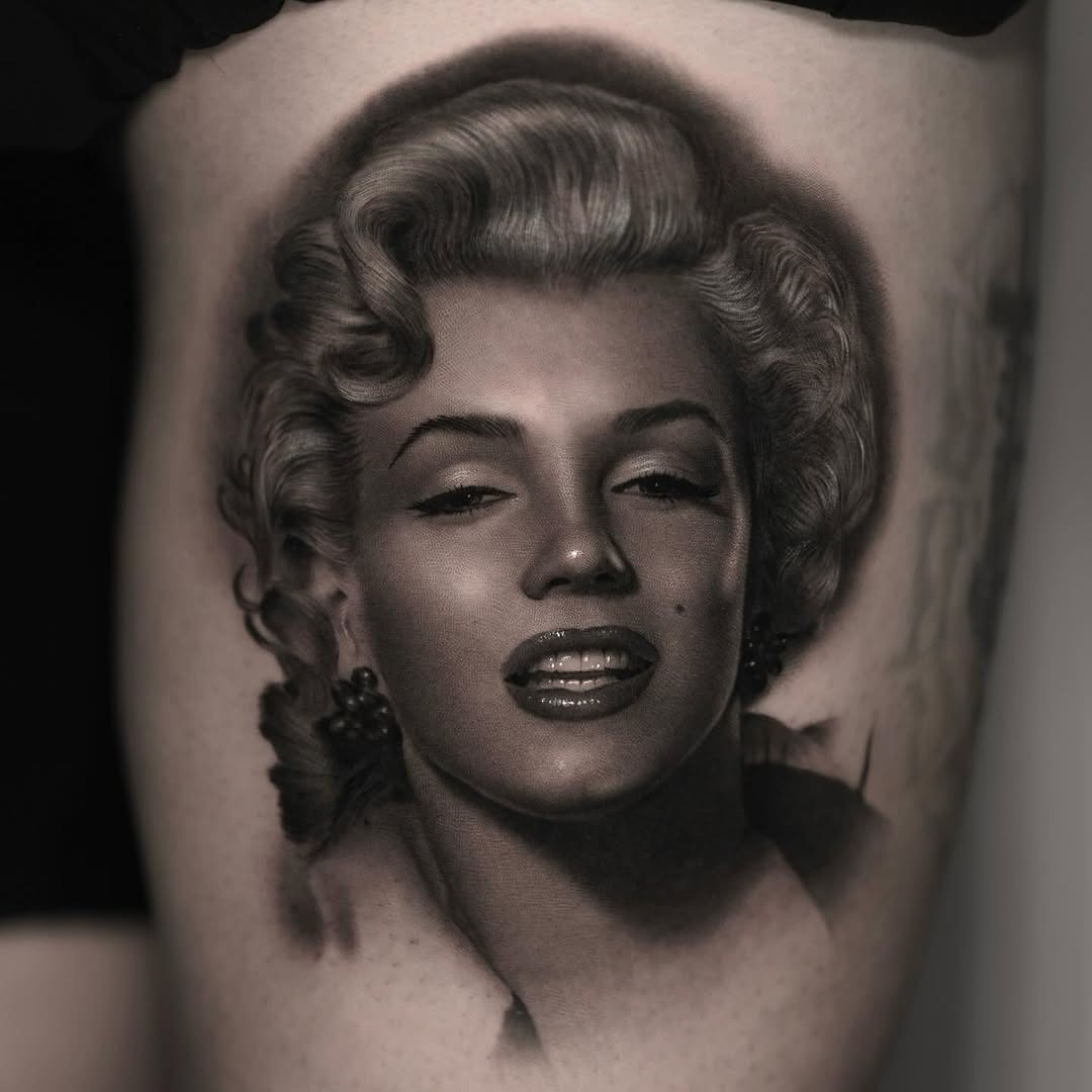 Stunning Marilyn Monroe portrait tattoo on thigh Tattoo Design