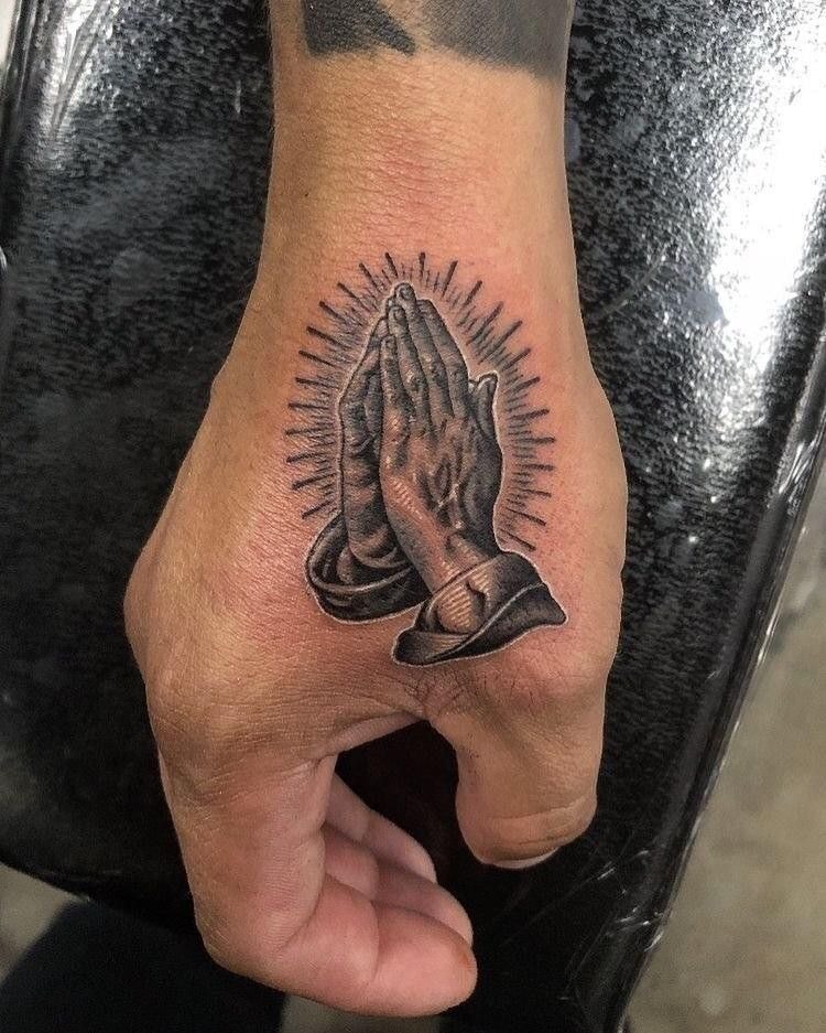 Radiant Hand Tattoo with Sacred Glow Tattoo Design