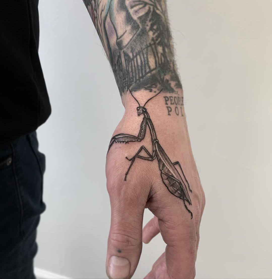 Realistic praying mantis tattoo on forearm Tattoo Design
