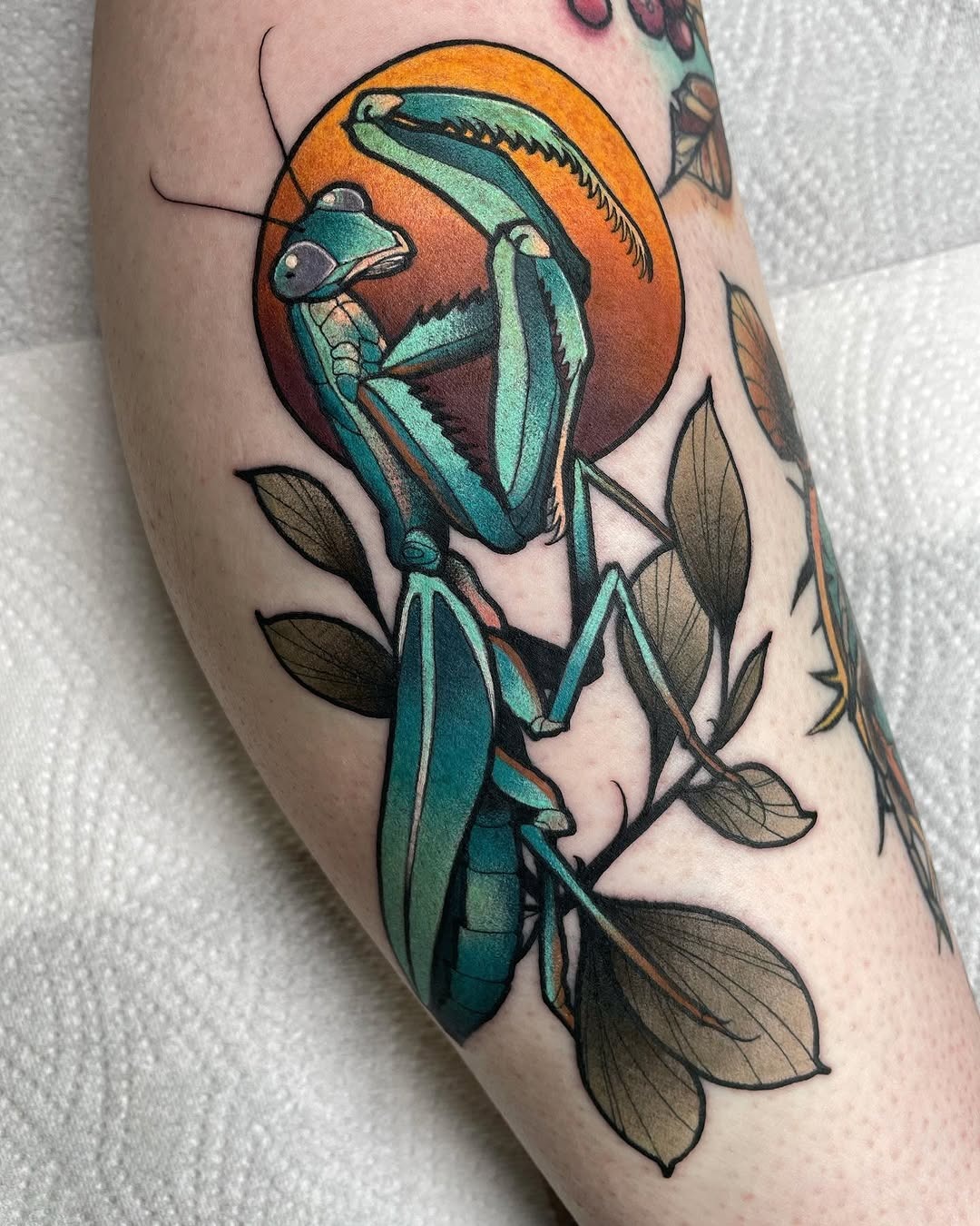 Vibrant praying mantis tattoo with unique colors Tattoo Design