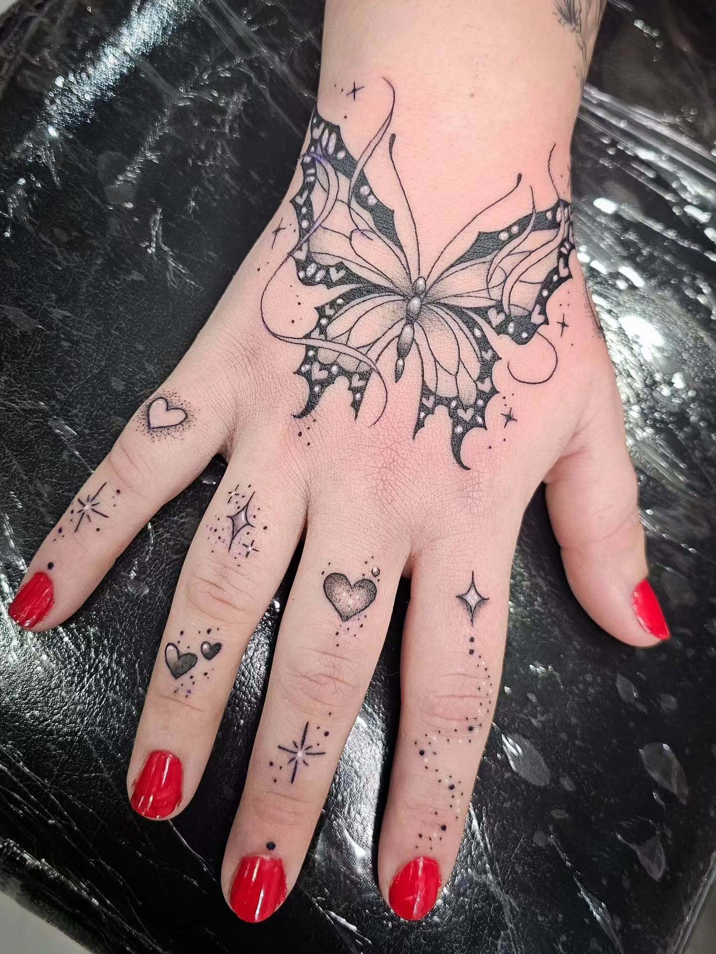 Butterfly and Tiny Hearts Hand Tattoo Tattoo Design