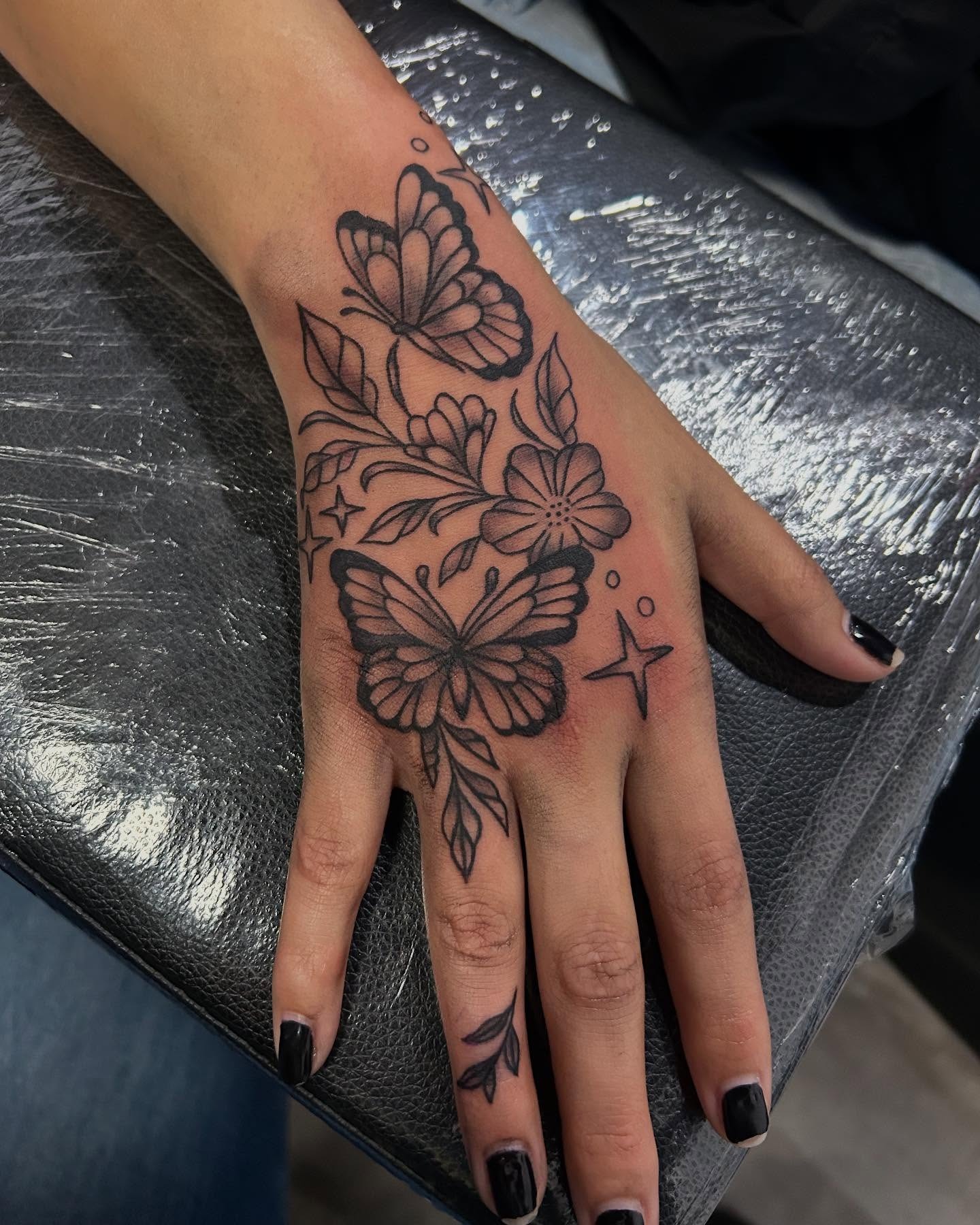 Flower and Butterfly Hand Tattoo Tattoo Design