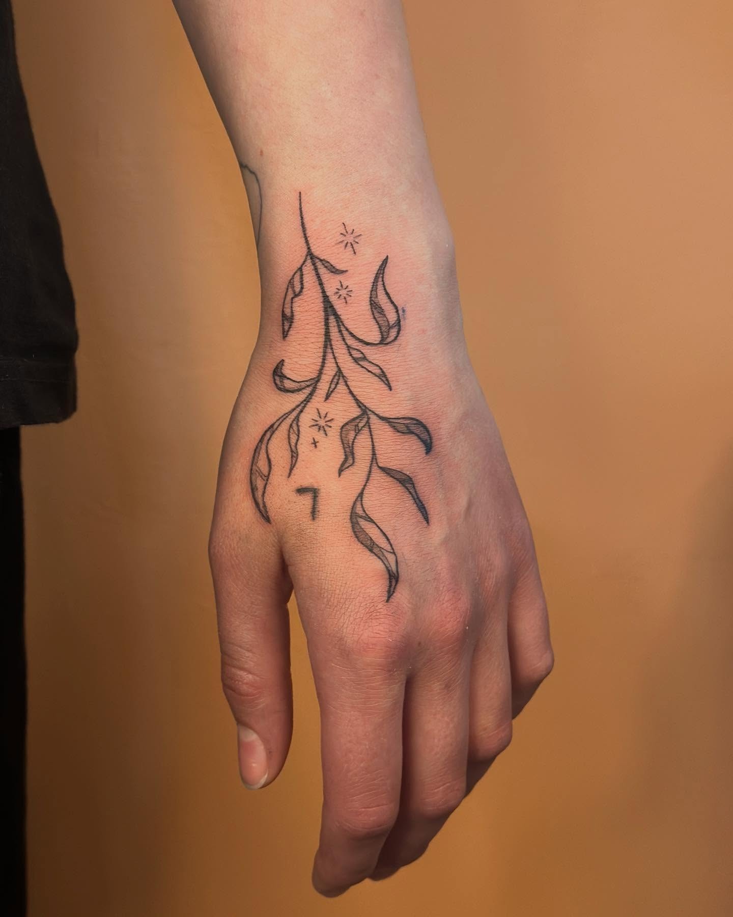 Hanging Vine and Sparkle Hand Tattoo Tattoo Design