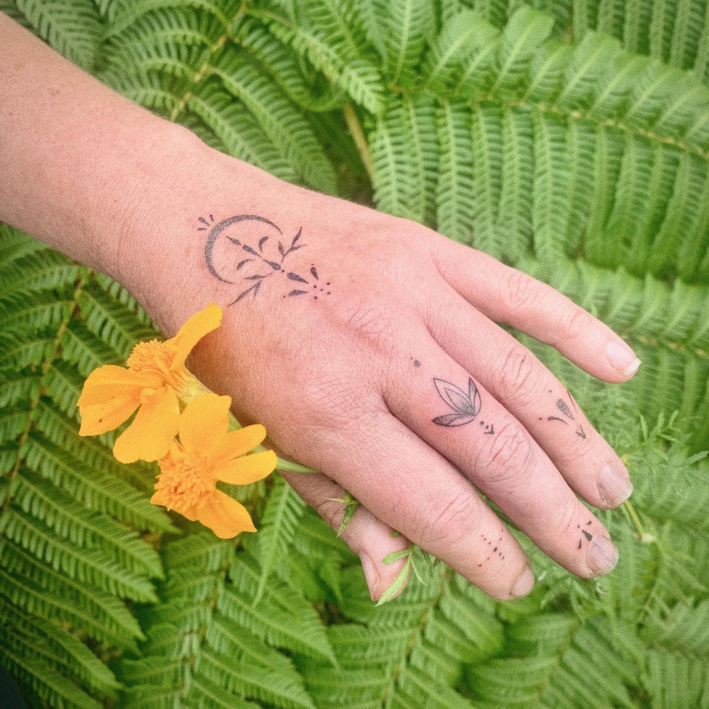 Moon and Botanical Fine Line Hand Tattoo Tattoo Design