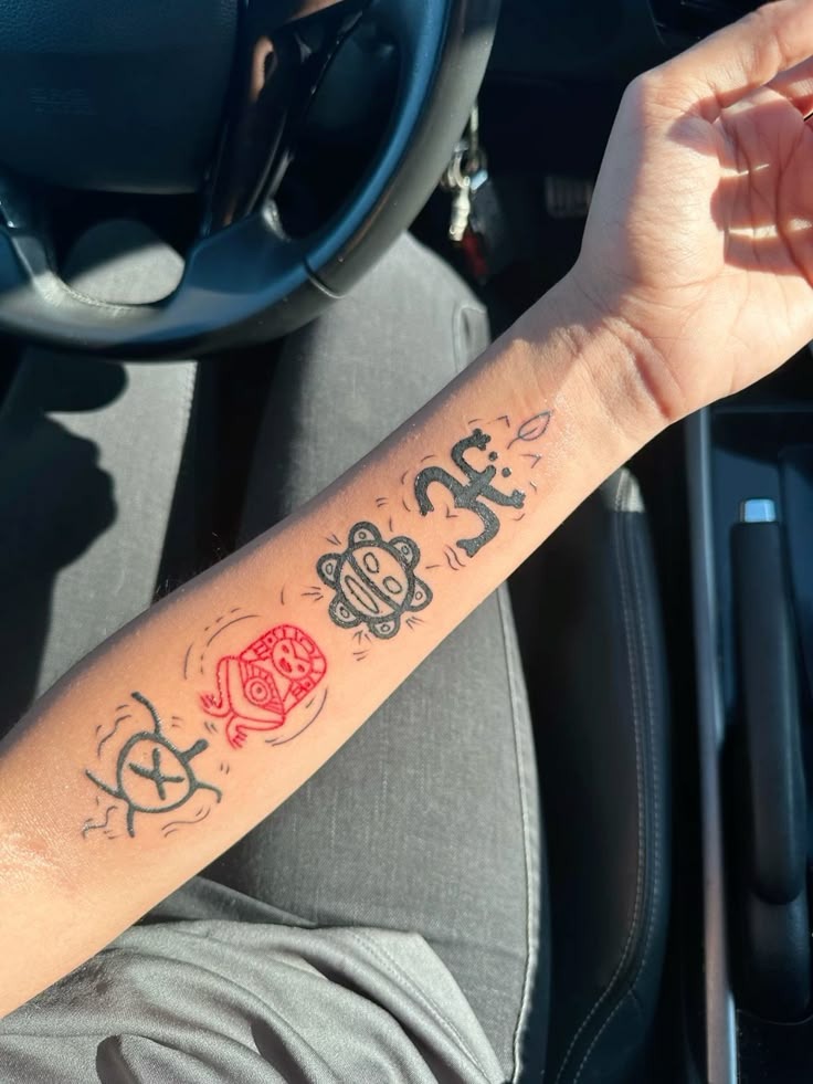 Playful Taino Symbol Forearm Set Tattoo Design