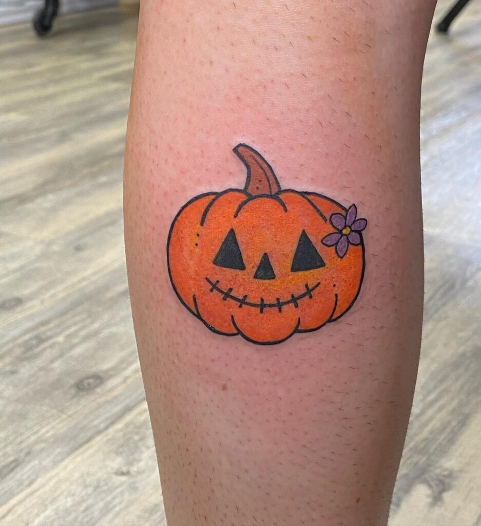 Cute Pumpkin with Flower Accent Tattoo Design