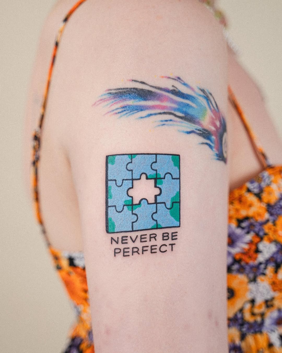 Colorful puzzle tattoo with empowering words Tattoo Design
