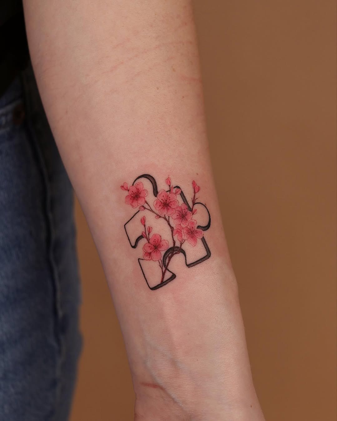 Floral puzzle piece tattoo with a unique twist Tattoo Design