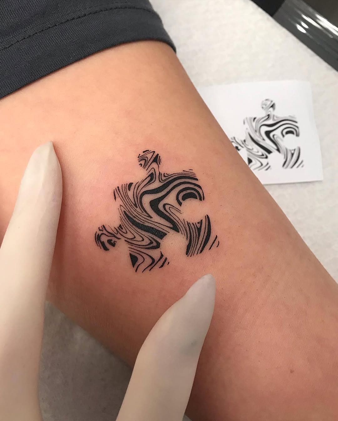 Sleek black and white puzzle tattoo design Tattoo Design