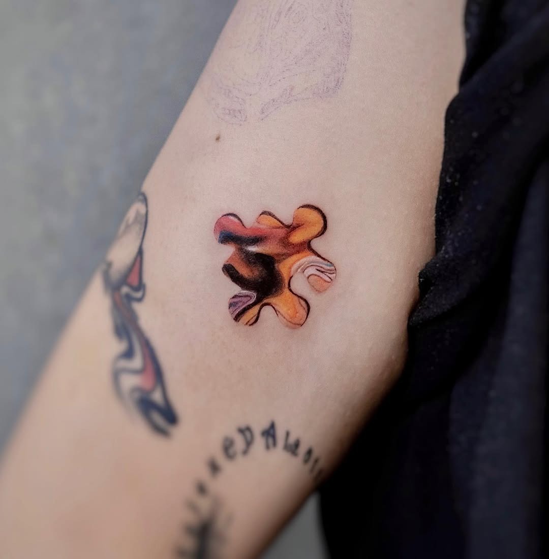 Stunning colorful puzzle piece tattoo design Tattoo Design
